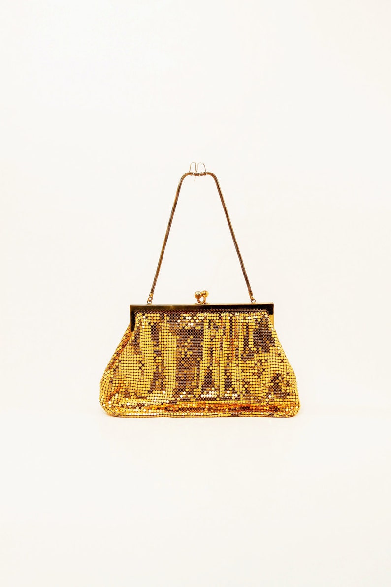 gold sequin clutch bag
