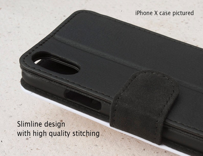 May include: Black leather iPhone X case with a flap closure and stitching detail. The case has a slimline design.