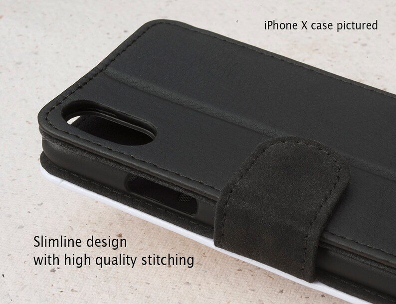 May include: Black leather iPhone X case with a flap closure and stitching detail. The case has a slimline design.