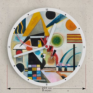 May include: A white clock face with black Roman numeral hour markers and black dots for the minute markers. The clock face features an abstract painting in shades of yellow, red, blue, green, black, and white. The clock is 203 mm in diameter.