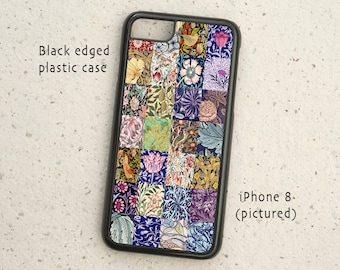 May include: Black phone case with a colorful patchwork design featuring floral patterns. The case is compatible with an iPhone 8.