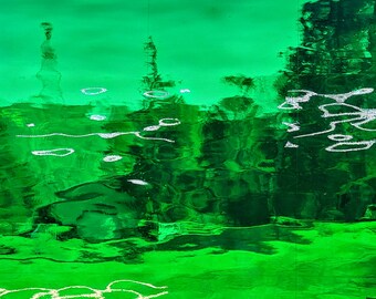 May include: Abstract image of rippling green water with white highlights and a light blue sky in the background. The water's surface reflects light, creating a dynamic and textured appearance. The overall effect is a vibrant and artistic representation of nature.