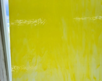 May include: A yellow glass panel with white streaks and a slight yellow tint.