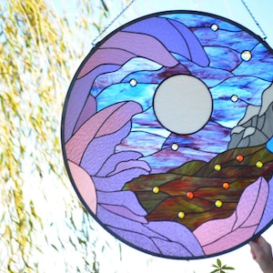 custom large round tiffany stained glass panel in purples, blues, greens, grey