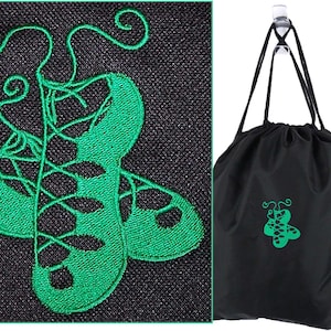 May include: Black drawstring bag with a green butterfly design. The bag is hanging from a clear hook. A close-up shows a green embroidered design of ballet shoes on a black background.