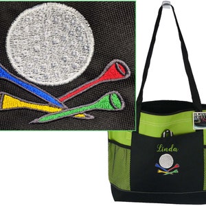 May include: A lime green and black golf tote bag with a black handle. The bag has a front pocket with the name "Linda" embroidered in green. The pocket also features an embroidered golf ball and tees in various colors.