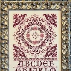 Rosie Rhapsody by Rosewood Manor Design. Primitive cross stitch printed pattern Release 2023