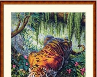 May include: A tiger with orange and black stripes drinks from a clear pool of water in a lush green jungle setting. The tiger's reflection is visible in the water.