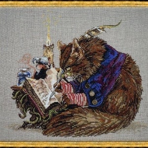 May include: A brown cat wearing a purple and blue robe sits at a desk with a quill pen in its paw. The cat is looking at a book open on the desk. There is a small bird perched on the book and a bottle of ink on the desk.
