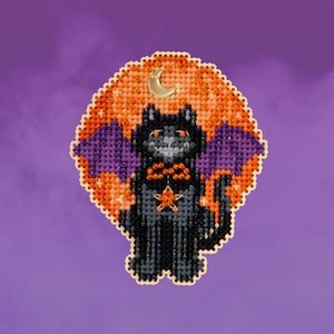 May include: A black cat with a bow tie and wings is depicted against a backdrop of an orange and yellow moon. The cat has a star on its chest and is surrounded by a purple and white halo.