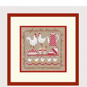 May include: Cross-stitch artwork featuring chickens, eggs, and kitchenware in red and white. The design includes text in a cursive font. The artwork is framed in a red border and set against a cream-colored background.