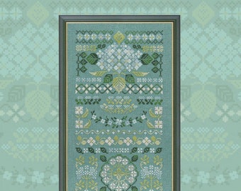 May include: Framed cross-stitch embroidery with a teal background and a detailed floral design in shades of green, white, and yellow. The design includes various floral patterns, leaves, and geometric shapes, all within a dark gray frame. The Owl Forest logo is in the bottom left corner.