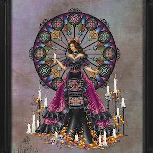May include: A framed cross-stitch design depicting a woman in a black and purple gown, holding a candle. A stained-glass window is behind her. The design includes candles, skulls, and floral accents. The Bella Filipina logo is visible.