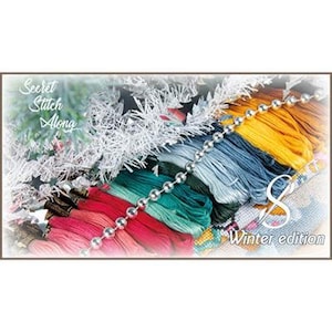 May include: A collection of embroidery floss in shades of pink, red, teal, blue, and yellow, accented by silver tinsel with star shapes and a silver ball chain. The text reads Secret Stitch Along 8 Winter edition in white script and font.