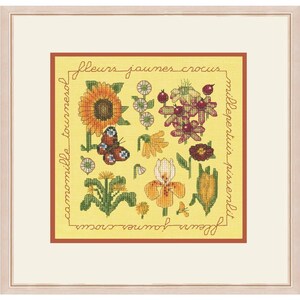 May include: A yellow cross-stitch sampler featuring a variety of yellow flowers, including sunflowers, daisies, and irises. The sampler is surrounded by a brown border with the text "fleurs jaunes crocus" and "camomille tournesol" written in French.