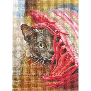 May include: A cross-stitch of a gray cat peeking out from behind a red and pink fringed blanket. The cat has yellow eyes and white whiskers. The text "COLLECTION D'ART" is visible at the bottom of the image.