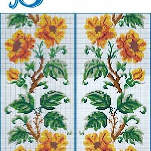 May include: A cross-stitch pattern featuring a floral design with yellow and orange flowers, green leaves, and brown stems. The word "SAJOU" is written in blue script at the top. The design is on a white grid background.
