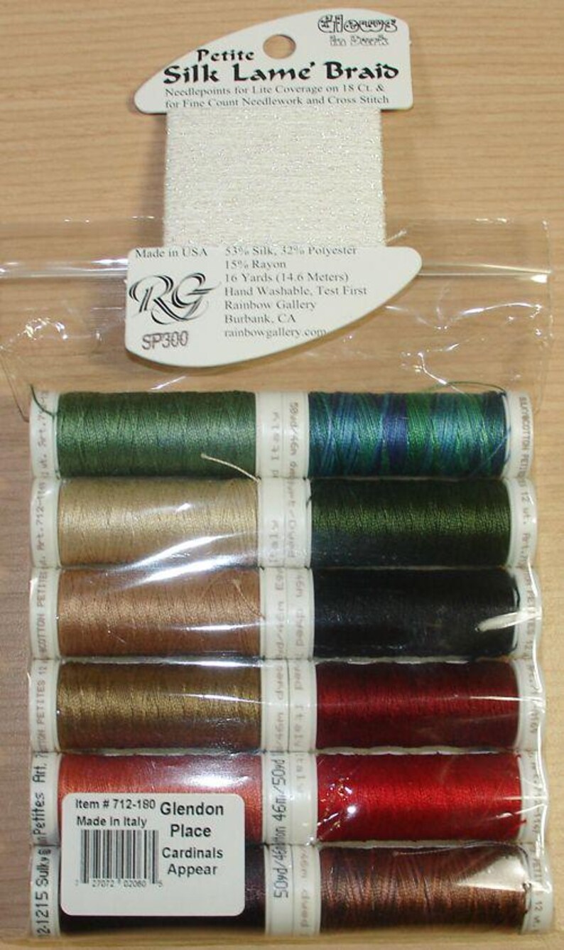 May include: A clear plastic package containing ten spools of thread in various colors including green, blue, gold, red, and brown. The packaging includes labels with text such as Petite Silk Lame Braid, 16 Yards, and Item 712-180 Glendon Place.