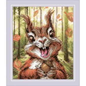 May include: Cross-stitch of a squirrel with a surprised expression, holding an acorn. The squirrel has brown fur, large eyes, and an open mouth. Autumn leaves fall in the background, with a forest scene. The artwork is framed in a lavender border.