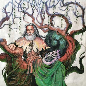 May include: A cross-stitch embroidery depicting a bearded man in a green and brown robe, sitting beneath a tree with vines. He holds a harp in his lap.