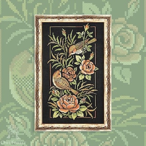May include: Framed cross-stitch art featuring two birds perched among peach-colored roses and green foliage against a black background. The artwork is in a gold-colored frame, showcasing a detailed floral and avian design.