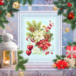 May include: A cross-stitch pattern featuring a winter floral arrangement with poinsettias, pine cones, and berries. The design is framed in a white frame and set against a light blue background.