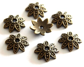 100 Perlenkappen 9mm groß Blume / Stern bronze antik Metall Metallkappen