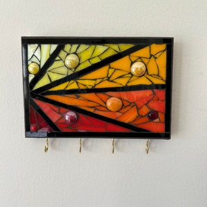 Mosaic stained glass wall hanging with 4 hooks, great for keys or jewelry. On MDF grouted in black and ready to hang.