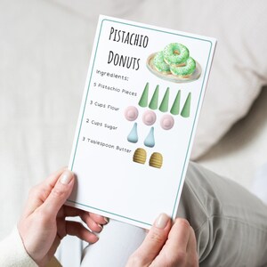 May include: A printable recipe card for pistachio donuts with illustrated ingredients: 5 pistachio pieces, 3 cups flour, 2 cups sugar, and 3 tablespoons butter. The card also features a watercolor illustration of pistachio donuts.
