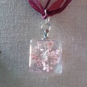 Hand made flower in  glass pendant and burgundy cord necklace