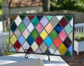 Clara.  Custom made Multi color, multi texture stained glass panel/ window/ transom