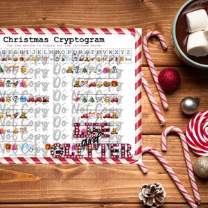 May include: A printable Christmas cryptogram puzzle with a red and white striped border. The puzzle uses emojis to represent letters and the solution is "Life and Glitter".
