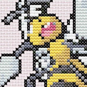 Puede incluir: Patrón de punto de cruz que presenta un personaje pixelado con detalles amarillos, rosas, negros, blancos y grises. El diseño recuerda a un videojuego retro o un personaje de dibujos animados clásico. Las puntadas crean una apariencia texturizada y hecha a mano.