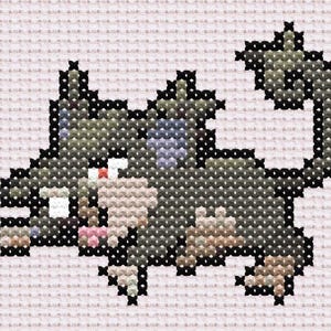 May include: Cross-stitch design of a cat in shades of grey, green, and tan, with black outlining. The cat is lying down with its tail curled. The background is a light pink fabric.