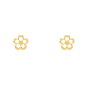 May include: A pair of gold-coloured flower-shaped stud earrings. Each earring features a five-petal design with a cutout centre. The earrings are displayed against a white background.