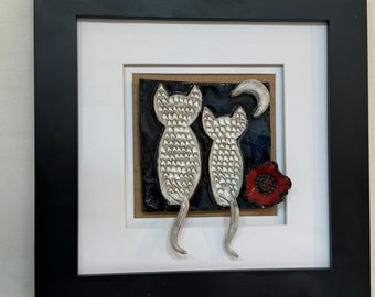 Pottery cats and the moon framed wall art