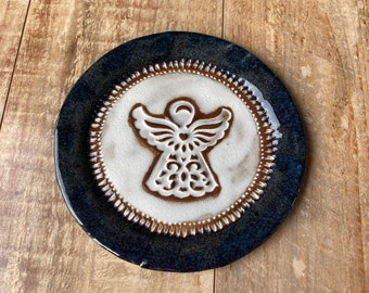 Handmade pottery plate with angel