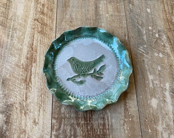 Handmade pottery plate with green bird