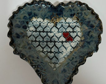 Handmade pottery heart tray with doily design