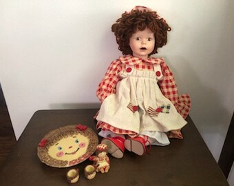 raggedy ann and andy porcelain dolls worth