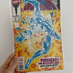 May include: A Marvel Comics Darkhawk #20 comic book cover featuring a blue and white superhero character with the text "Darkhawk" and "Pureheart: The Ultimate Hope Unleashed!"