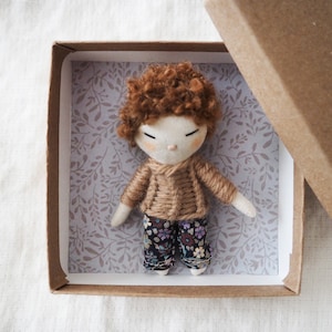 Micro miniature pocket boy doll in a kraft and floral box image 1