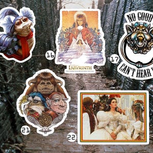 May include: A collection of stickers featuring characters and imagery from the movie Labyrinth. The stickers include images of goblins, the film's poster, and quotes like "The Babe with the Power."