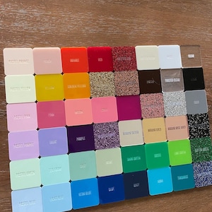May include: A color chart of acrylic sheets with various colors and finishes, including frosted, mirror, and glitter. The colors include pastel orange, yellow, pink, purple, green, blue, peach, orange, red, coral, lilac, purple, sea foam, sage, olive, dark green, green, lime green, turquoise, light blue, ocean blue, blue, navy, aqua, and white.