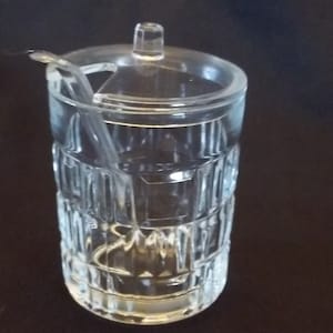 Small glass jar for honey or jam, jellies or sugar
