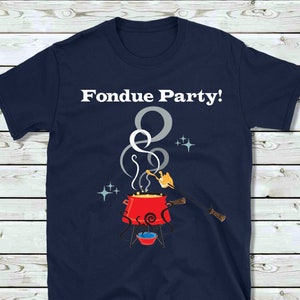 May include: A navy blue t-shirt with the text "Fondue Party!" in white. The shirt features a cartoon illustration of a red fondue pot with a fork dipping into the cheese.