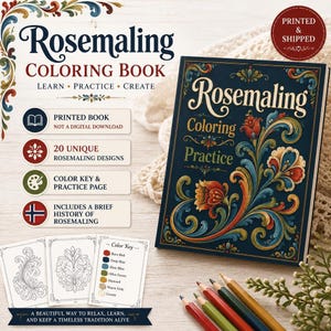 Könnte beinhalten: Ein Rosemaling-Malbuch mit dunkelblauem Einband und floralen Schnörkeln in Rot, Orange und Blau. Das Buch enthält 20 Motive, einen Farbschlüssel und die Geschichte dieser Kunstform. Mehrere Buntstifte liegen neben dem Buch.