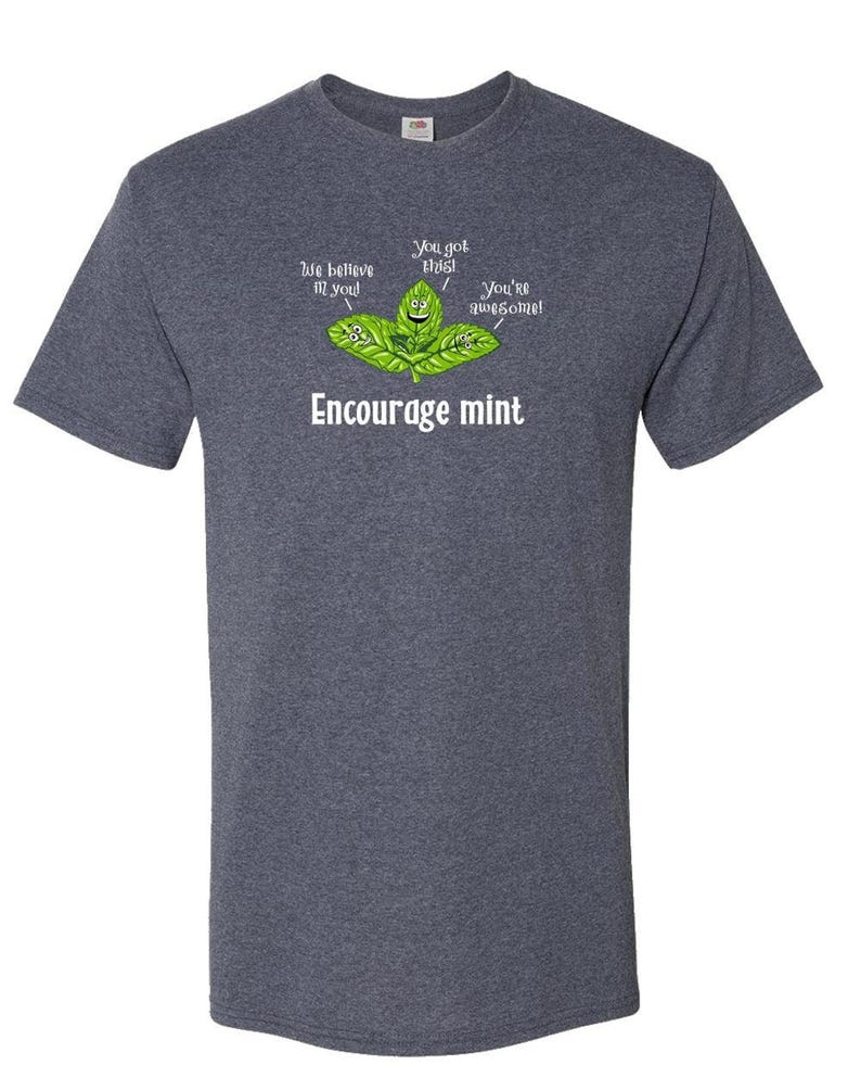 A dark heather gray t-shirt featuring a graphic of smiling mint leaves with the text Encourage mint.