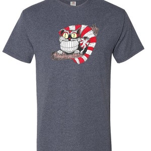 May include: A heather gray t-shirt with a cartoon illustration of a Cheshire Cat with a wide grin and red and white stripes. The cat is sitting on a branch.