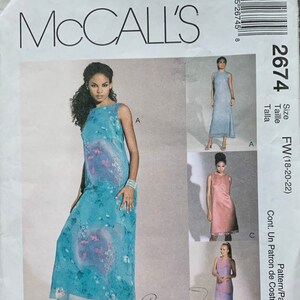 May include: McCall's sewing pattern featuring a sleeveless maxi dress with floral print. The pattern includes multiple views of the dress in various colors. The text "Creative Clothing" is visible.